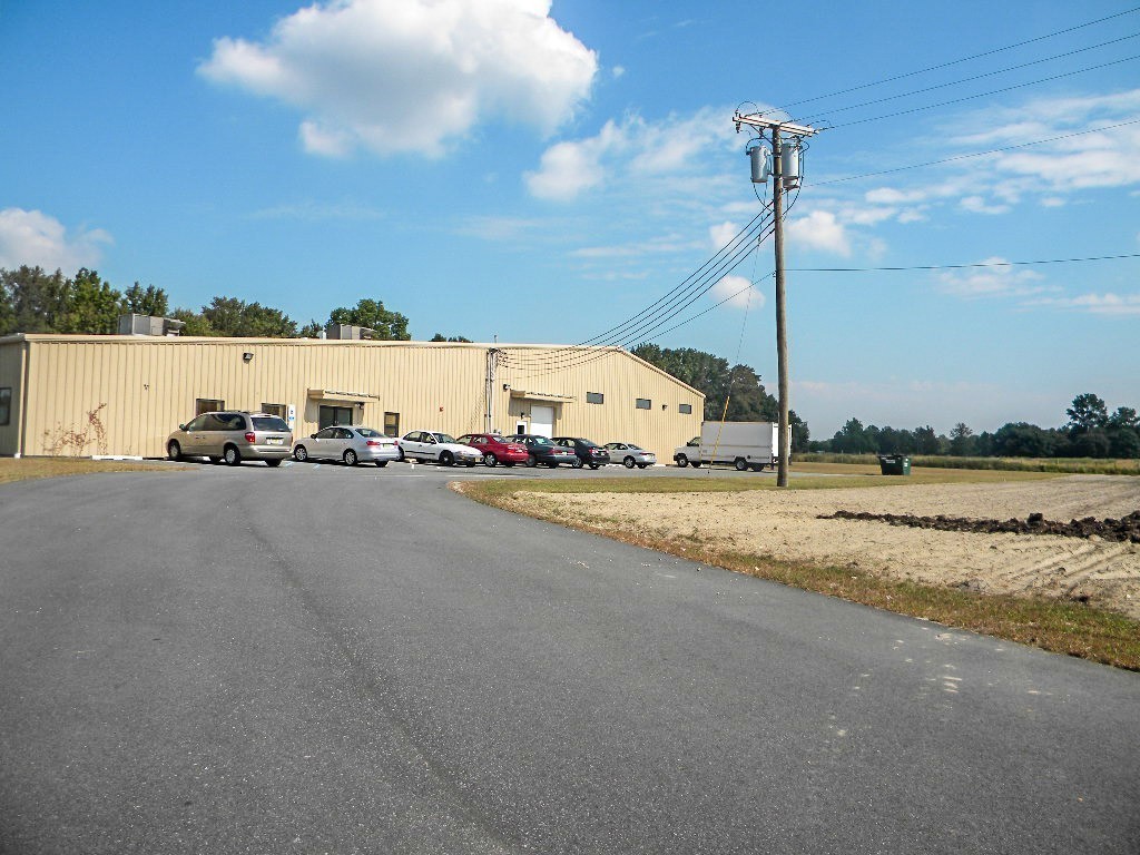 Headquarters with cars parked in lot